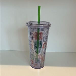Clear Travel Tumbler with Green Straw and Postage-Stamp Motif